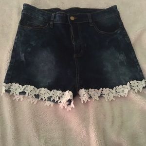 Blue jean shorts. White lace bottom.